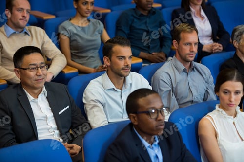 Preview: Business executives listening to speech
