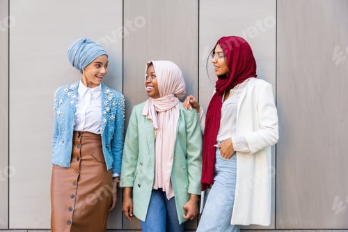 Preview: Beautiful muslim girl wearing hijab bonding outdoors