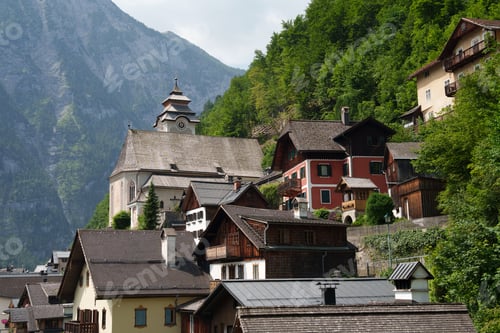 Preview: A mountain village in the arms of the Alps. Many houses and a temple. Hallstatt.