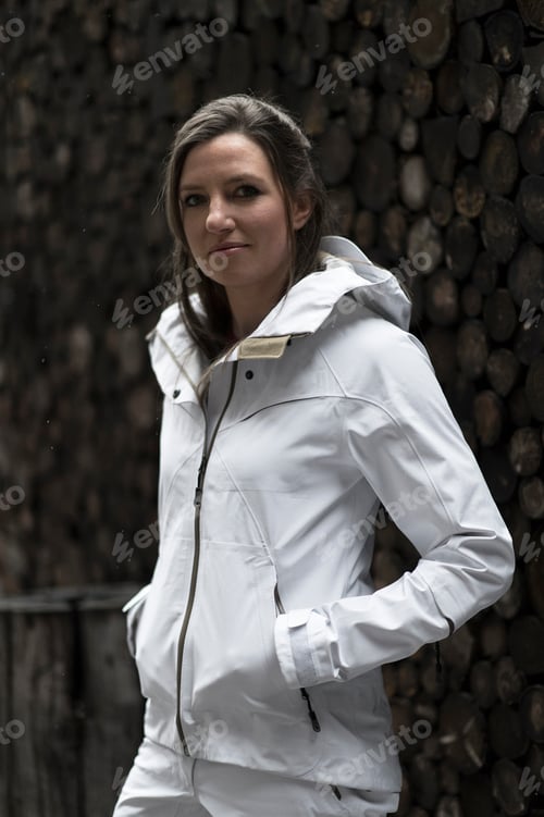 Preview: Mid adult woman wearing white coat, portrait