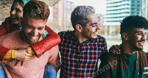 Preview: Young diverse people having fun outdoor laughing together - Focus on right guy face