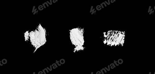 Preview: three white abstract paint strokes isolated on black surface isolated f