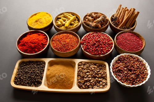 Preview: various spices on black background