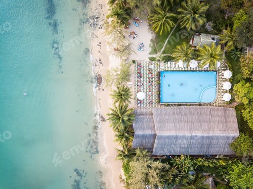 Preview: Aerial shot of a tropical paradise resort with a pool and white beaches.