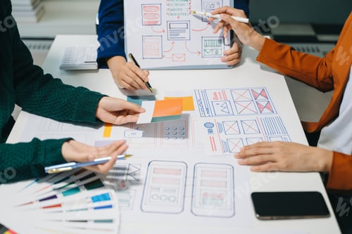 Preview: UX developer and ui designer brainstorming about mobile app interface wireframe design
