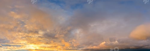 Preview: Golden Sunset Cloudscape Over Calm Horizon With Warm Orange And Blue Tones