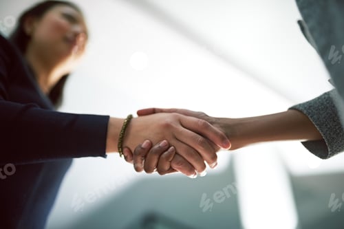 Preview: Shaking on their success. Cropped shot of two creative businesspeople shaking hands.