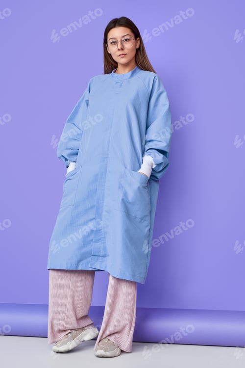 Preview: Woman in Oversized Scrubs on Purple Background