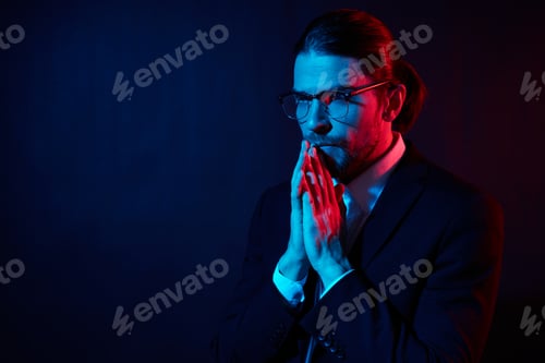Preview: stylish man gestures with his hands with glasses isolated background