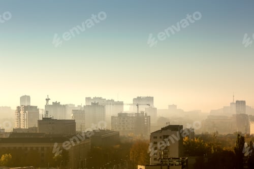 Preview: Cityscape at sunrise, building rooftops, bird view