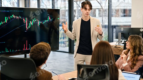 Preview: Young worker leading business meeting about cryptocurrencies in an office