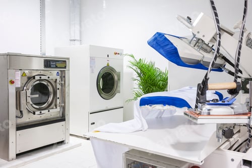 Preview: Modern Industrial Laundry Room with Washing and Ironing Equipment