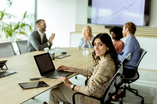 Preview: Radiant professional woman excels during a dynamic office meeting in bright workspace