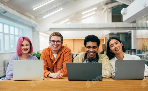 Preview: young programmers working on a new project for a start up business.