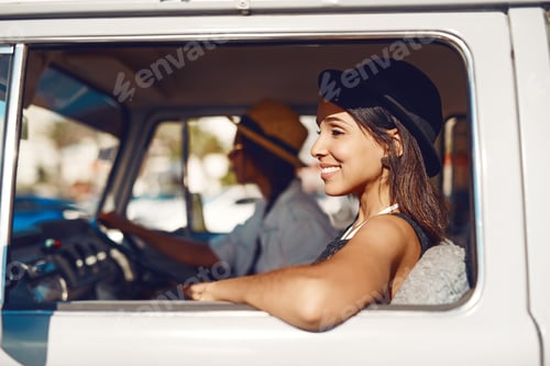 Preview: Life is out there. Go to it. Shot of two happy young friends enjoying a relaxing road trip.