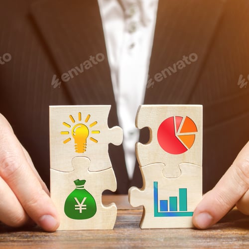 Preview: Businessman collects puzzles with the image of the attributes of doing business