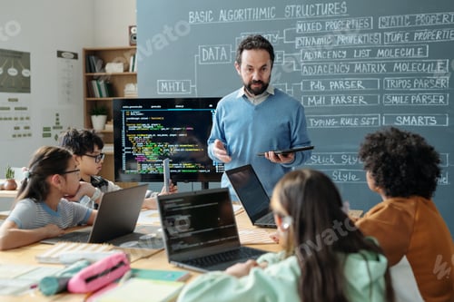 Preview: Teacher Guiding Students in Classroom with Computers