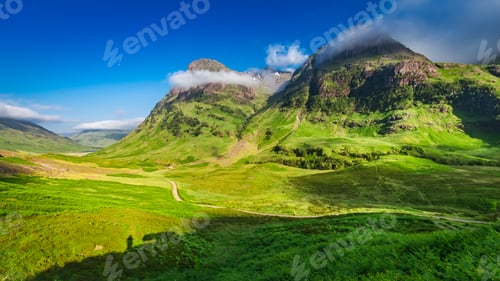 Preview: Beautiful sunrise and tiny shadow of man, Glencoe, Scotland