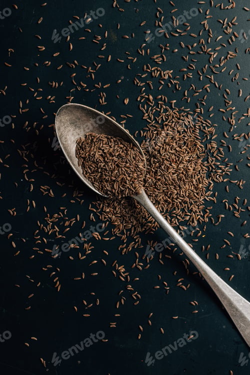 Preview: top view of caraway on spoon and dark table
