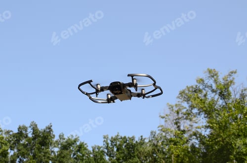 Preview: Drone with photocamera take off from land and flying for take aerial photo