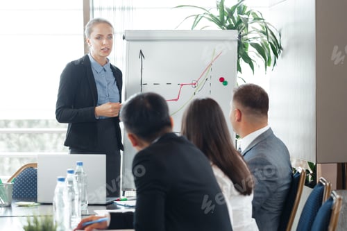 Preview: Business meeting focused on strategy presentation in modern office setting