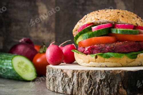 Preview: Delicious vegetarian beet burger showing fresh ingredients on rustic wood