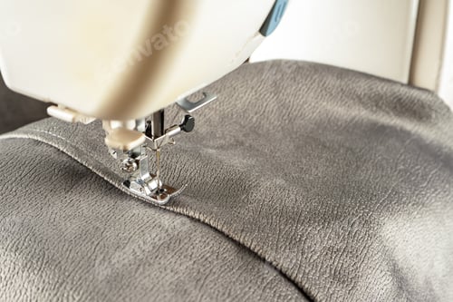 Preview: Modern sewing machine and gray fabric. Sewing process, handmade, hobby, DIY, business, repair