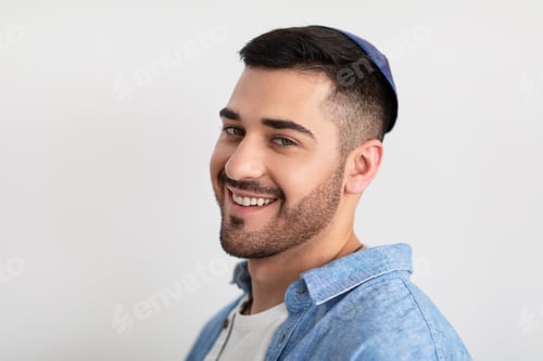 Preview: Closeup headshot portrait of smiling jewish man in kippa