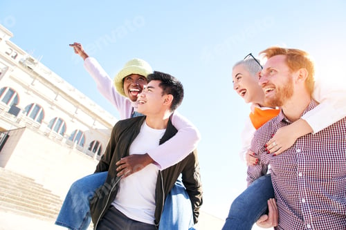 Preview: Piggyback friends smiling together outdoors on sunny vacation day. Couples sightseeing in free time