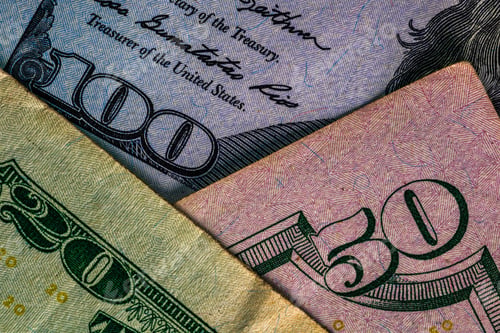 Preview: Closeup of US dollar money banknotes - inflation and economy concept