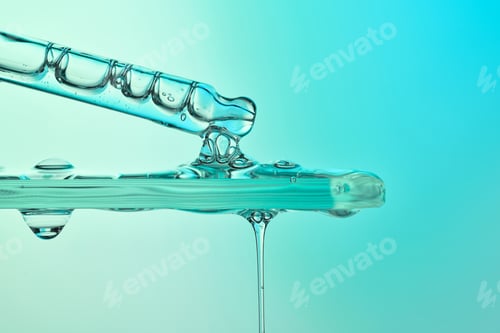 Preview: Pipette dripping clear serum onto glass surface