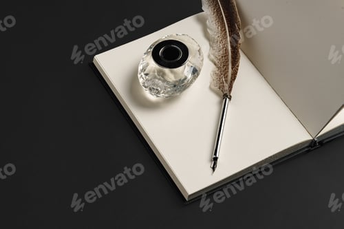 Preview: Notebook and feather pen on working table