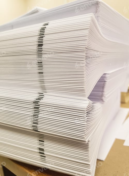 Preview: A stack of blank paper, book blocks prepared for binding in a printing house