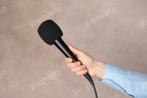 Preview: Woman holding microphone on color background, closeup