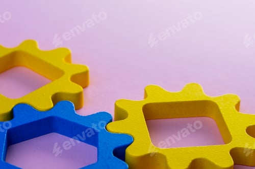 Preview: Interlocking gear shapes on a pink background.
