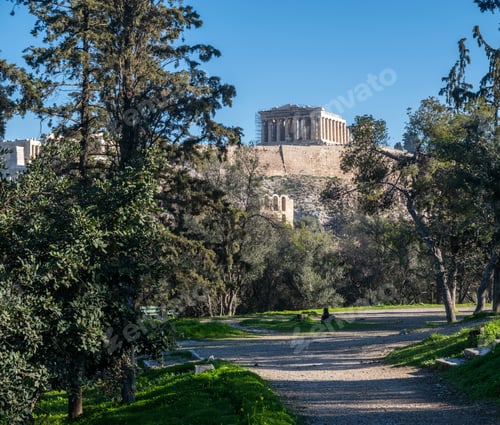 Preview: Athens, Greece. Parthenon on Acropolis hill and Herodeion, blue sky.