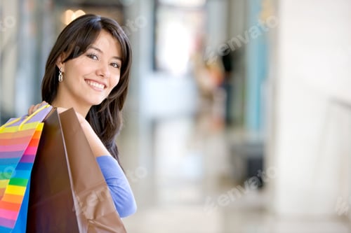 Preview: Beautiful Woman Holding Bags In A Shopping Mall