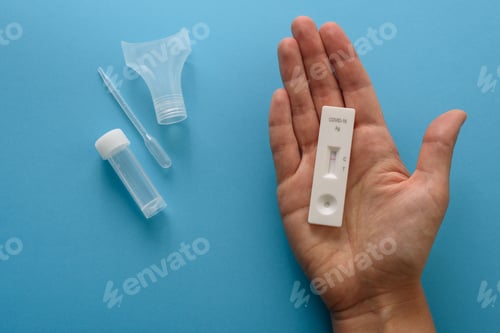 Preview: Hand showing antigen covid test