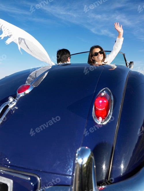 Preview: Couple in an old convertible