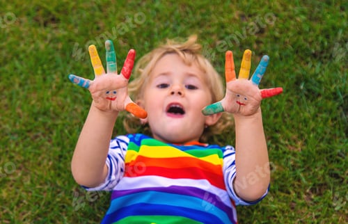 Preview: Child in hand draw smile. Selective focus.