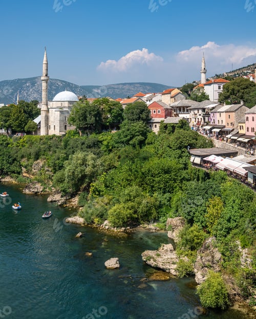 Preview: Neretva River Meandering Through a Lush Green Hillside in Mostar, Bosnia and Herzegovina
