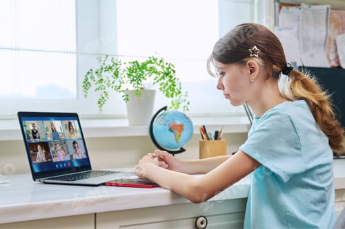 Preview: Teen Girl Learning Online At Home With Laptop