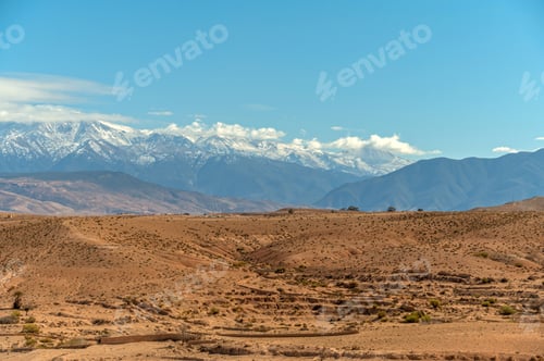 Preview: Vast expanses of Agafay desert reveal distant snow-capped mountains in Morocco