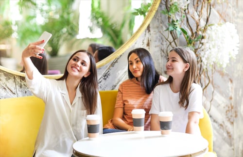 Preview: Diverse friends resting in cafe