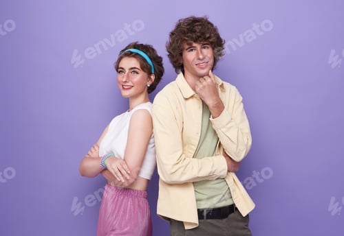 Preview: Back-to-back photo of young happy smiling cheerful couple of friends with crossed hands