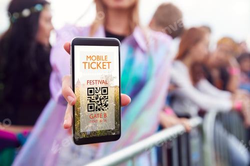 Preview: Close Up Of Woman Holding Mobile Phone Screen To Camera As She Arrives At Entrance To Music Festival