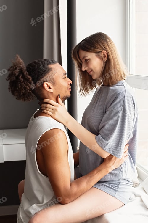 Preview: Multiracial couple, guy and girl face to face, in home