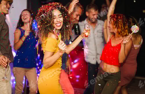 Preview: Young friends dancing at new year's eve party