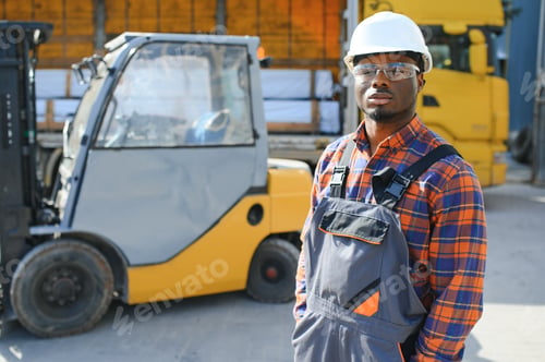 Preview: African logistics man as a forklift driver in the warehouse of a freight forwarder