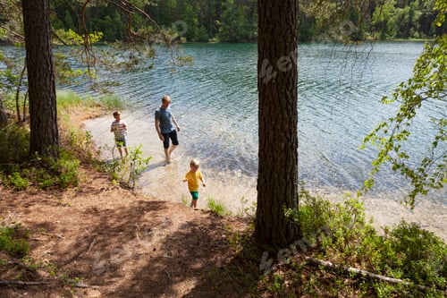 Preview: Family enjoying a serene lakeside moment